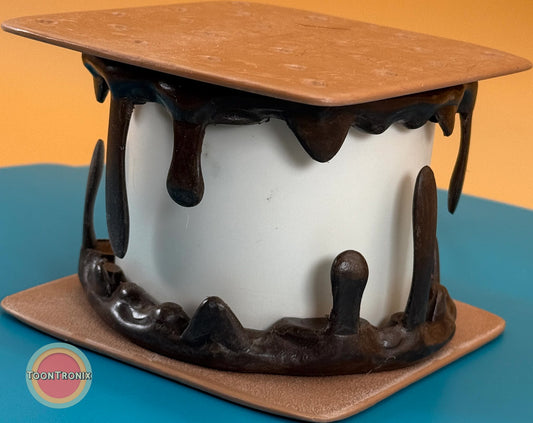 Smores desk lamp with melting chocolate and graham cracker design in retro cartoon style