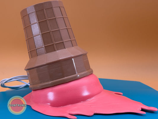6-inch or 9-inch retro style ice cream desk lamp with melting pink ice cream and USB cord on blue surface