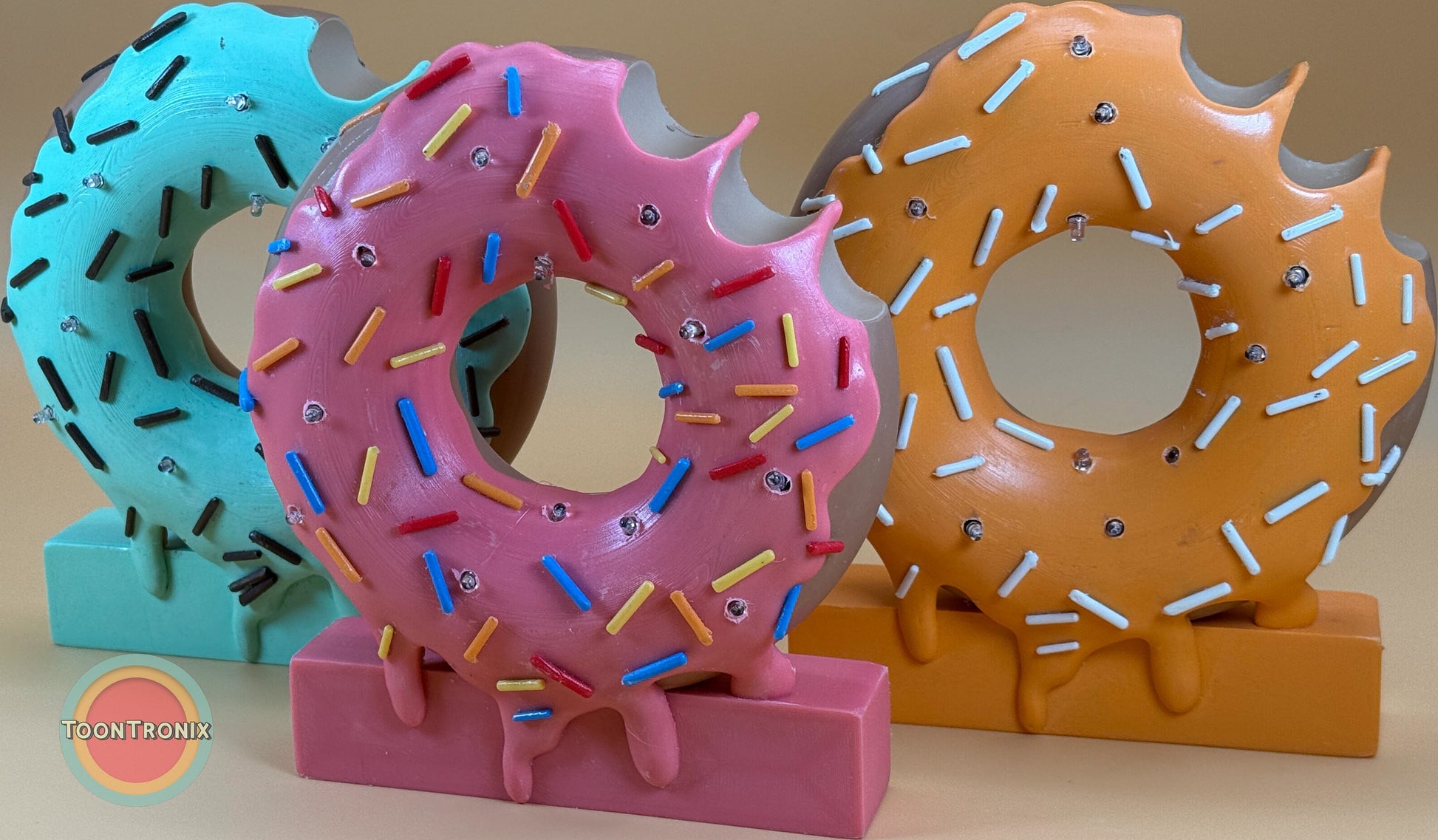 6 or 9 inch donut desk lamps with colorful sprinkles in pink, blue, and orange designs on rectangular bases