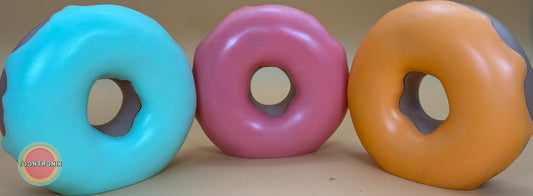 Colorful retro-style donut desk lamps in blue, pink, and orange with vibrant cartoon design and built-in USB power cord