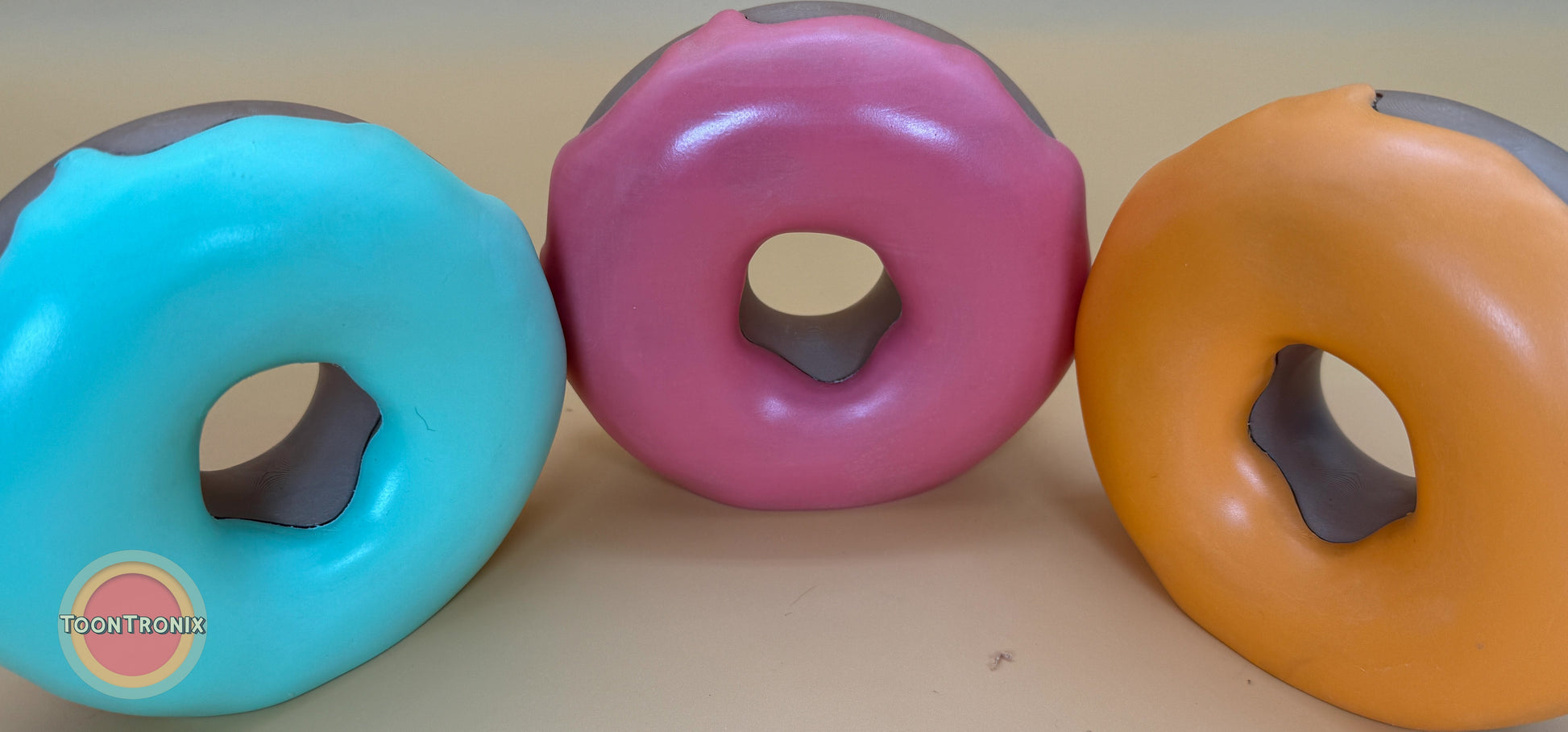 Colorful 6 or 9 inch donut desk lamps in blue, pink, and orange with glossy finish and USB power cord.