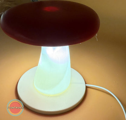 6" or 9" mushroom-shaped desk lamp with glowing white stem and red cap on round base with USB power cord