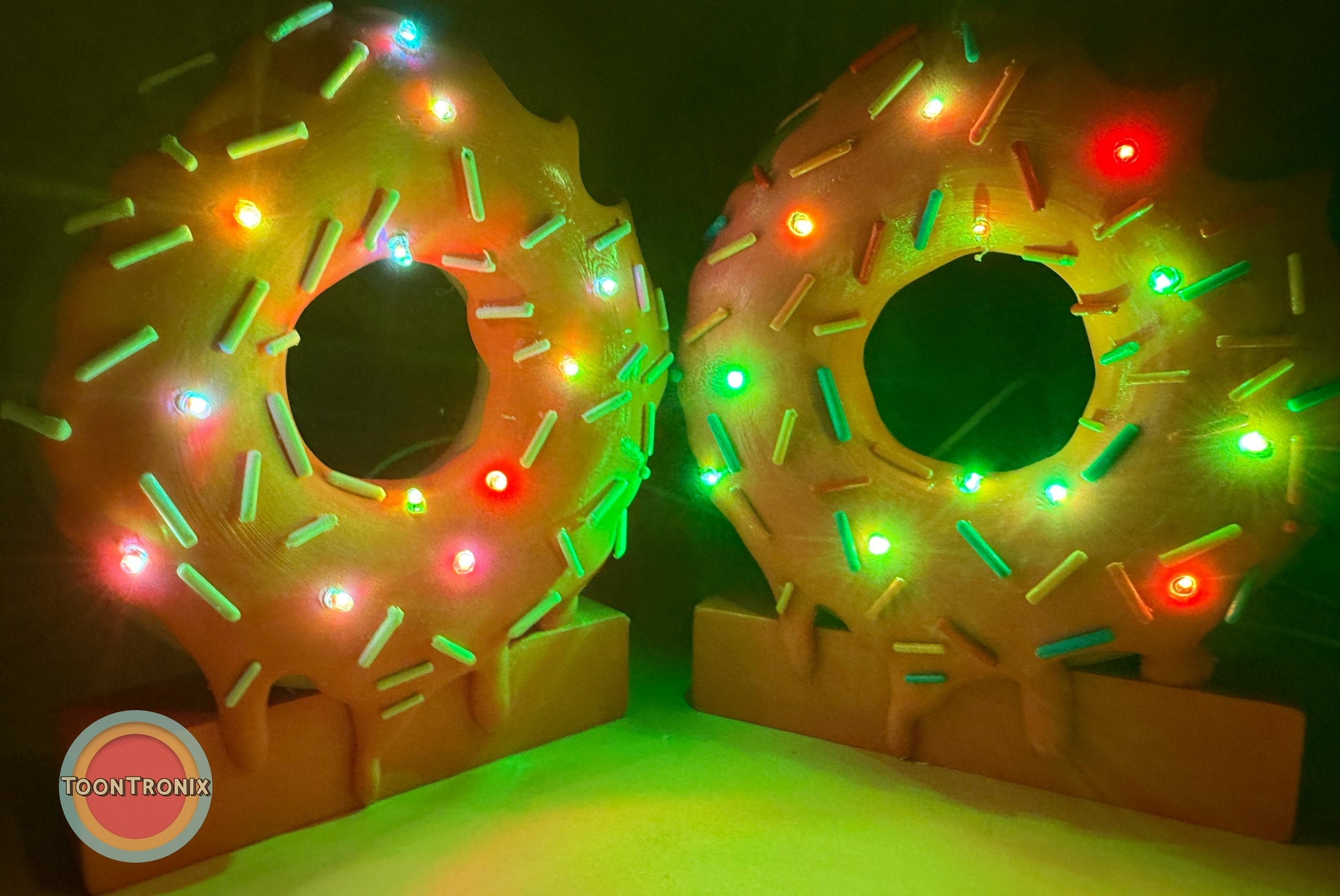 6" and 9" donut desk lamps with colorful sprinkles and glowing LED lights on a dark background