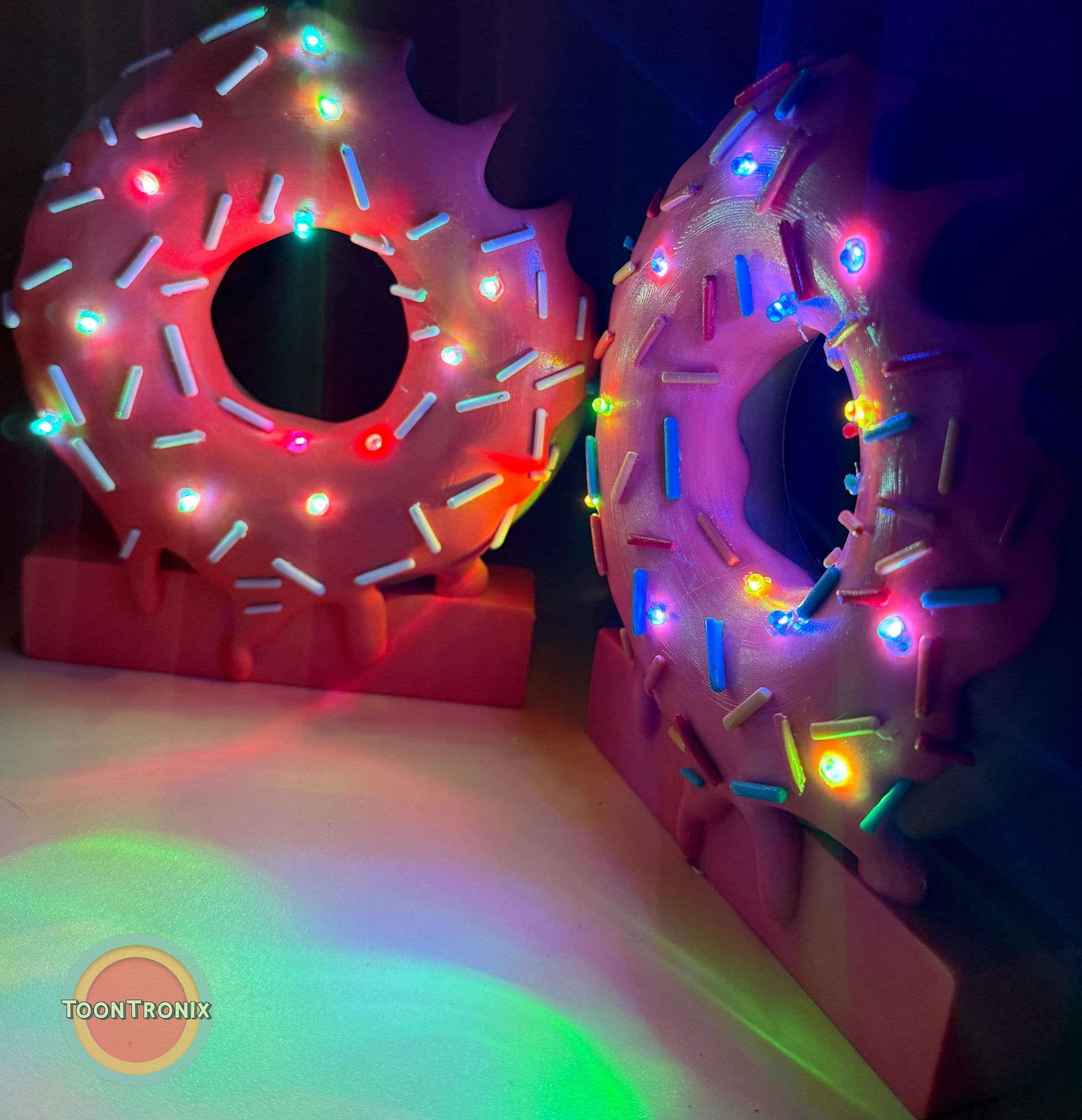 6 inch and 9 inch donut desk lamps with colorful sprinkles and built-in LED lights on USB-powered bases