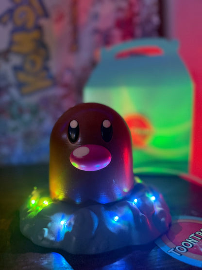 6" tall Diglett Pokemon LED desk lamp figure with USB cord and wood-like finish illuminated by colorful lights