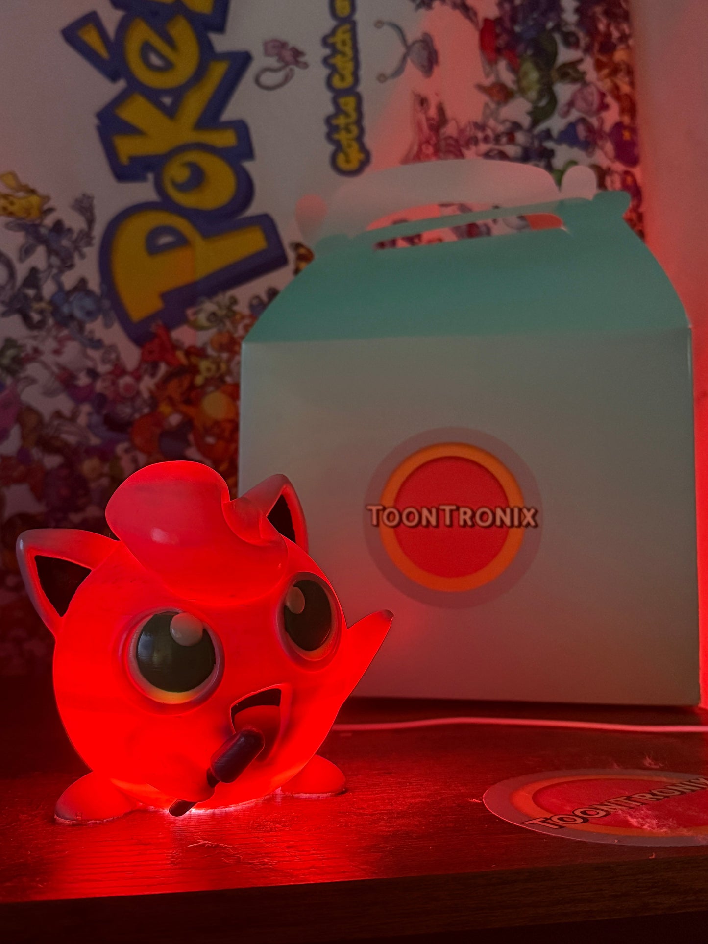 4.6" Jigglypuff desk lamp glowing red with USB cord and ToonTronix packaging in the background