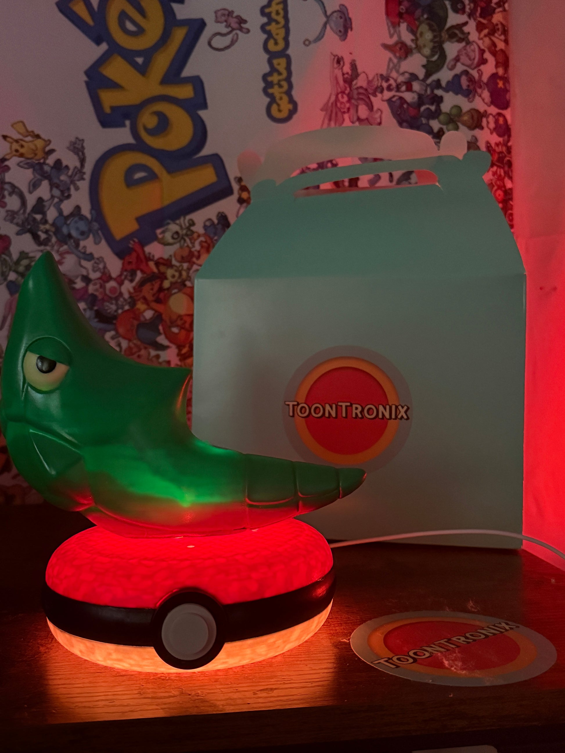 8" Metapod Pokemon statue desk lamp with USB cord on Pokeball base illuminated in red light