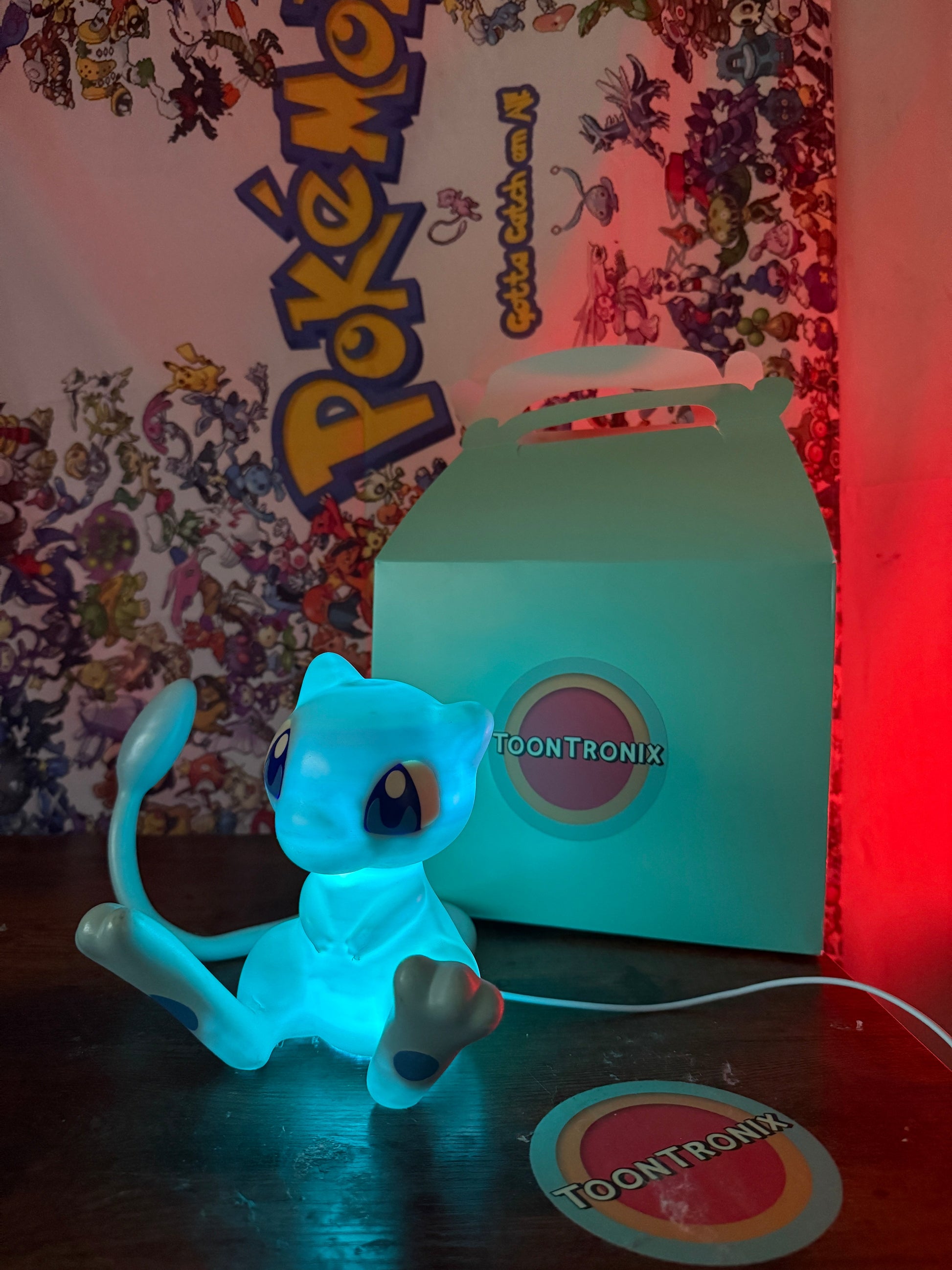 6-inch tall shiny Mew Pokemon LED desk lamp with USB cord and wood-like finish