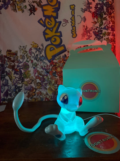 6" tall 11" wide shiny Mew LED desk lamp with USB cord and wood-like finish from Toontronix