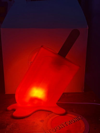 Red glowing 6-inch popsicle shaped LED desk lamp with USB power and retro cartoon design