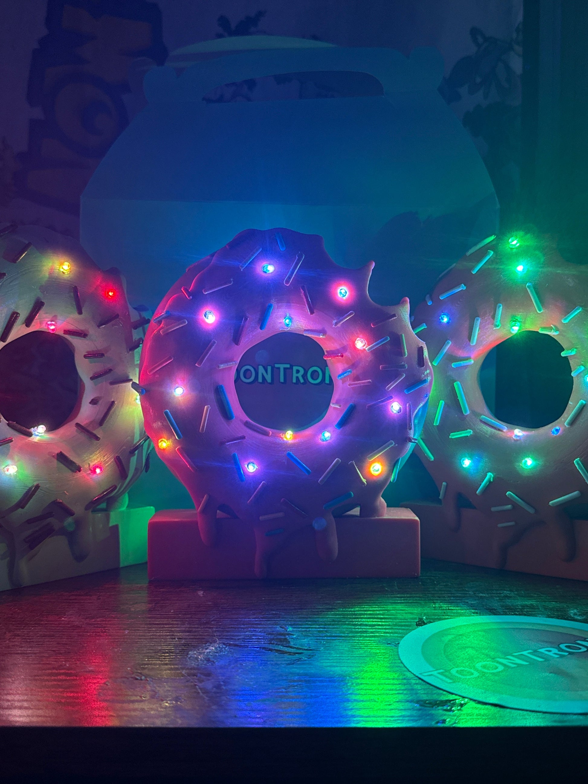 LED donut desk lamps with colorful sprinkles and built-in USB light, available in 6" or 9" sizes
