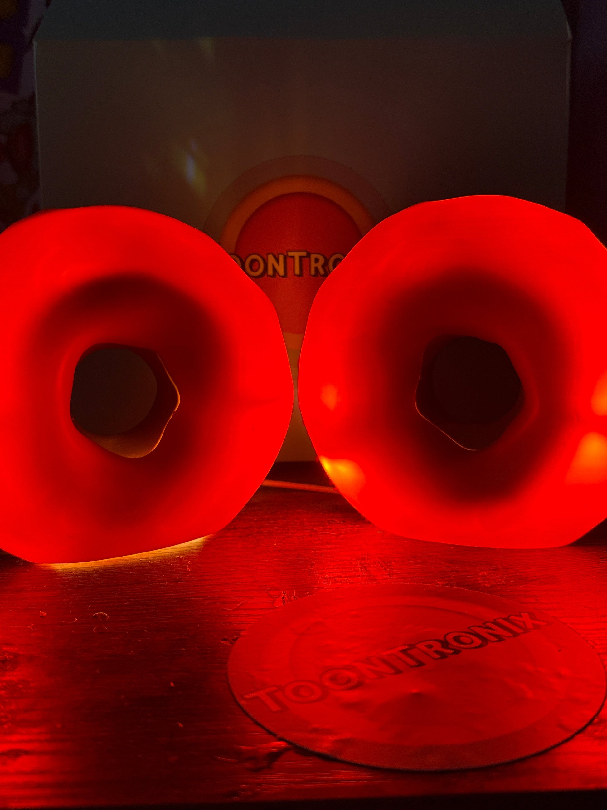 Glowing red donut-shaped USB desk lamps in 6 and 9 inch sizes with retro cartoon design and wood finish.