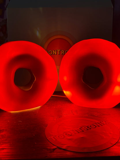 Glowing red donut-shaped USB desk lamps in 6 and 9 inch sizes with retro cartoon design and wood finish.